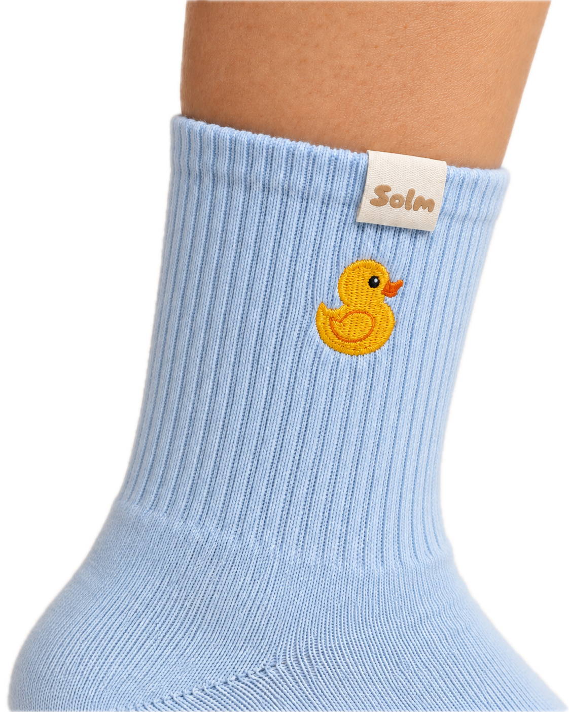 Little Quack on foot, with the duck embroidery and woven Solm tag