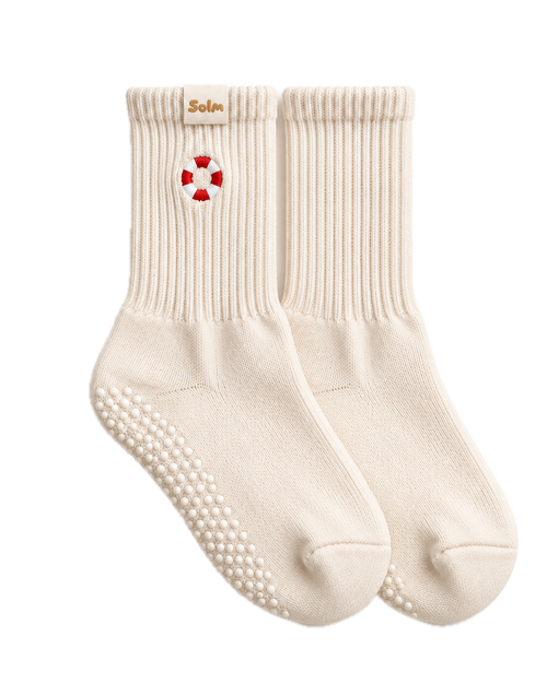 Stay Afloat grip socks, a pair laid flat